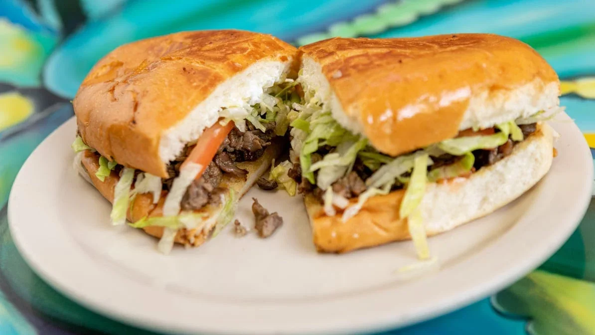 Torta - Mexican sandwich on a bolillo roll with meat, avocado, and toppings